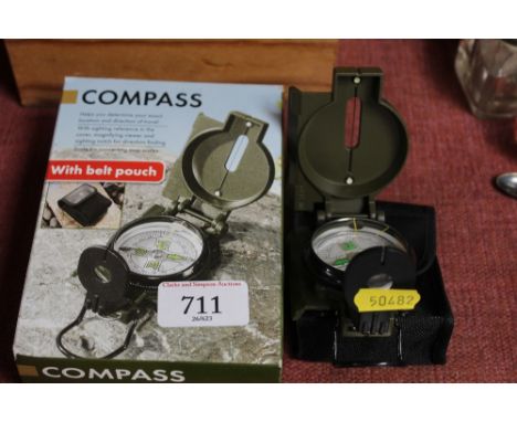 A compass with belt pouch with original box