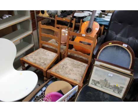 A set of four ladder back dining chairs