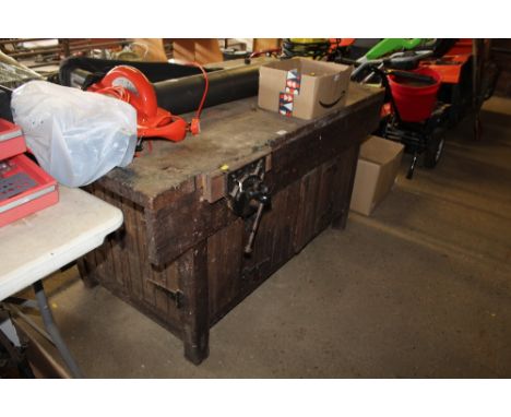 A wooden work bench with under storage and a Record No. 52 bench vice fitted and a Record No.52½&nbsp; bench vice