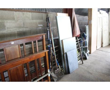 A quantity of long handle garden tools to include shovel, rake etc