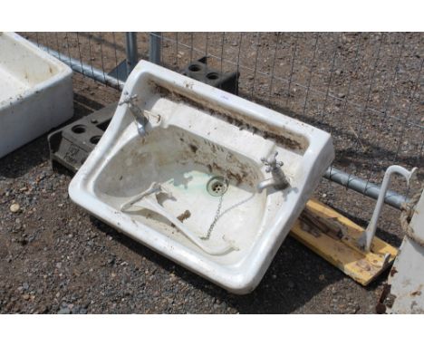 A basin with cold and hot taps