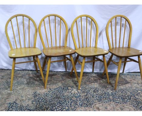 A set of four Ercol elm seated stickback chairs. Not available for in-house P&amp;P 