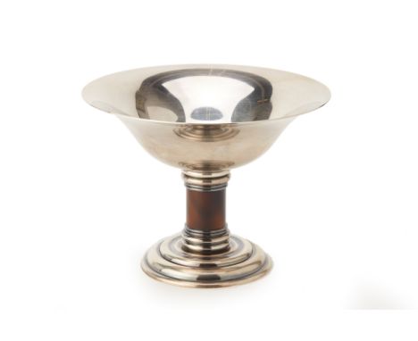 A PUIFORCAT SILVER PLATED AND ENAMEL TAZZA
With stepped base and enamel stem
13.5cm high x 18cm diameter
Condition: Minor sig