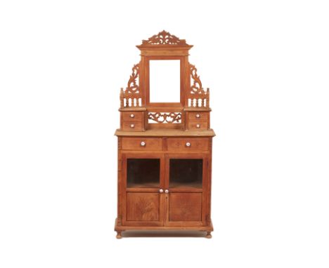 A SMALL PERANAKAN STYLE MIRROR BACK DRESSER
The mirror surmounted with a carved and pierced cresting, an arrangement of drawe