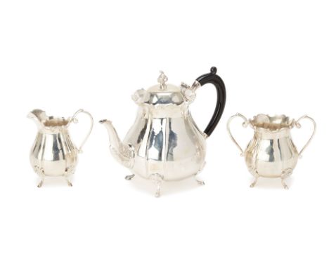 AN INDIAN COLONIAL SILVER THREE PIECE TEA SERVICE
In the European taste with scroll rim and on foliate hoot supports, marked 