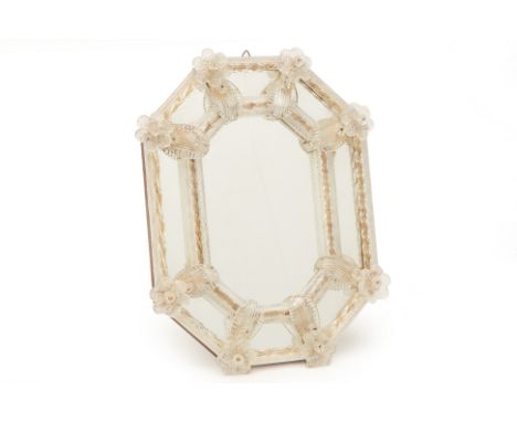 A VENETIAN OCTAGONAL GLASS TABLE MIRROR
With floral decoration
32cm x 24cm
Condition: No obvious condition issues