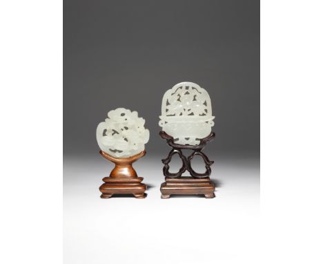 TWO CHINESE WHITE JADE OPENWORK PENDANTS QING DYNASTY One formed as a basket containing a large flower growing amongst leaves