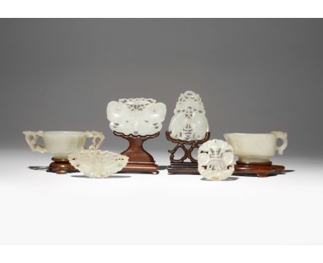 SIX CHINESE WHITE AND CELADON JADE ITEMS QING DYNASTY Comprising: a small pouring vessel set with a loop handle, a two-handle