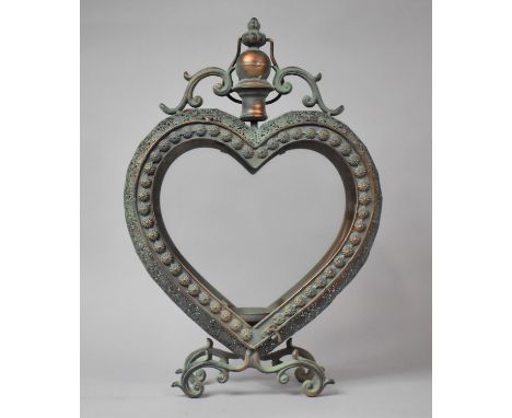 A Large Glazed and Pierced Green Patinated Heart Shaped Metal Candle Stand/Lantern, 53cm high
