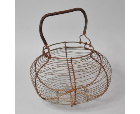 A Vintage Wire Egg Basket, 28cm high 