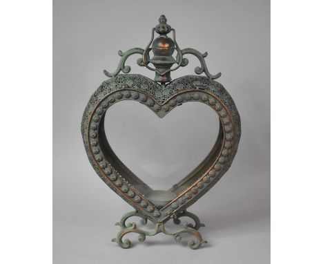 A Large Glazed and Pierced Green Patinated Heart Shaped Metal Candle Stand/Lantern, 53cm high