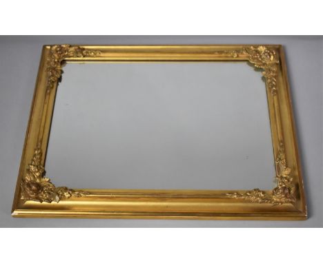 A Small Gilt Framed Wall Mirror with Floriated Decoration, 25x33cm 