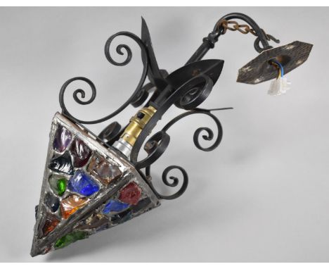 A Mid 20th Century Wrought Iron Hall Lantern with Pyramid Shaped Coloured Glass Mounted Shade, 40cm high 