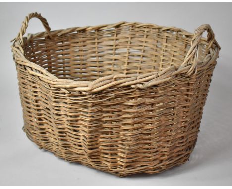 A Vintage Wicker Two Handled Basket, 58cm wide 