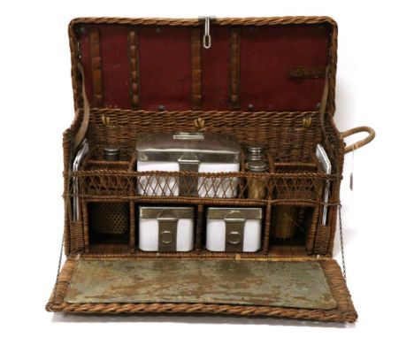 A 1920/30s Wicker Picnic Set, with hinged lid and fall front enclosing enamel and chromium plated fittings (a/f), 58cm wide  