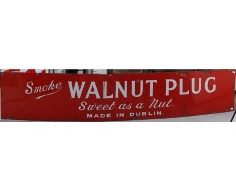 A Red Enamel Single-Sided Advertising Sign: Smoke Walnut Plug Sweet as a Nut, Made in Dublin, with assorted metal drill holes