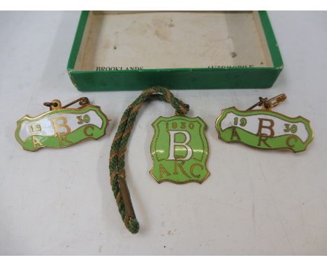A set of three Brooklands Automobile Racing Club enamel members badges for 1930, in original box of issue, stamped no. 607.