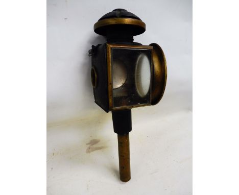A brass mounted carriage lamp.