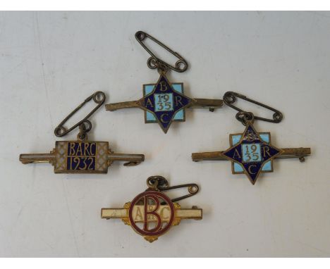 Four Brooklands Automobile Racing Club enamel badges, two  from 1935, one from 1932 and one other. 