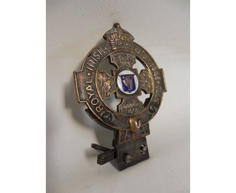 A Royal Irish Automobile Club car badge, stamped D898.