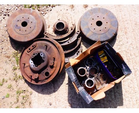 A 1928 Graham Paige pair of rear back plates, brake drum shoes and assorted other mechanical items. 