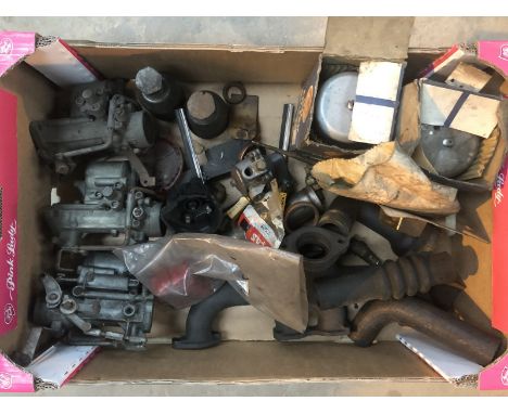 Two boxes of assorted parts to include Vauxhall Bedford factory parts in original packaging, carburettors, pullers etc.