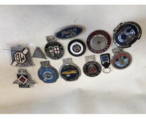 A quantity of assorted car badges to include Junior Car Club, MG Car Club and Morris Minor Owners Club.