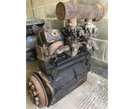 A BMW 2-litre 6-cylinder engine, twin downdraught carburettors, possibly industrial.