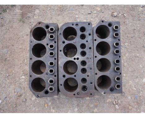 Three Austin 7 engine blocks.