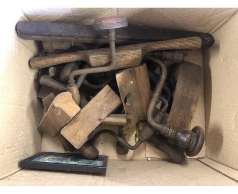 A box of woodworking tools, including braces.