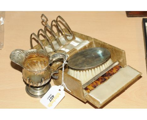 Silver toast rack, silver backed brush and comb, silver bracelet and a Victorian silver gilt jug 