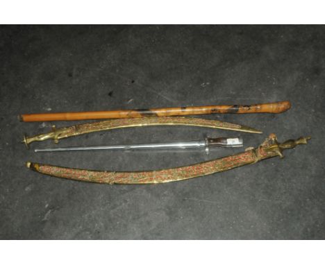 Ornamental bayonet, swords and measuring walking stick  