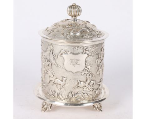 having a gadrooned finial handle above the repoussé lid set with dragons chasing a pearl above the body decorated with tradit