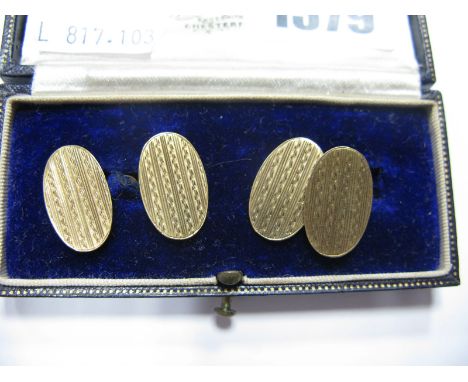 A Pair of Chester Hallmarked 9ct Gold Gent's Cufflinks, the engine turned oval panels on chain connections, in a fitted case.