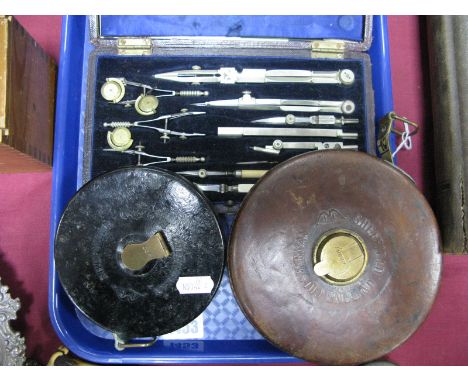 Chesterman of Sheffield Wind Up Rulers, in leather and bakelite cases, Elliott of London geometry set.
