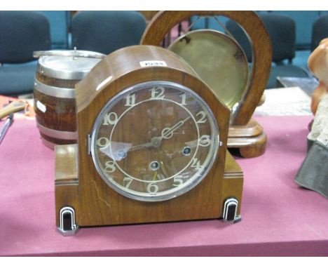 An Art Deco Walnut Cased Mantel Clock, with black and white bakelite mounts, Westminster Chimes movement, for Wm Greenwood &a