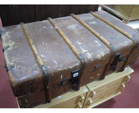 A c.1930's Wooden Bound Travel Trunk, with leather carry handles, initialled "G.C.W.".