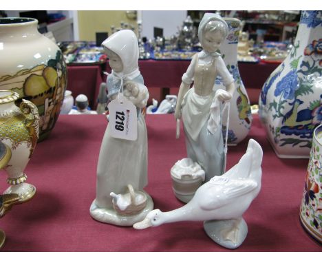 Two Nao Pottery Figurines of Young Ladies, another of a goose. (3)