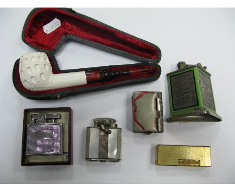 A Vintage Table Lighter, with bridge scoring details, further lighters, book vesta case, cased pipe.