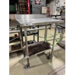 SS Table next to labeler, on castors