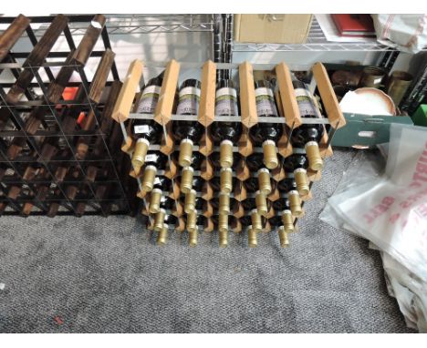 A modern light wood and metal wine rack, capable of holding 30 bottles