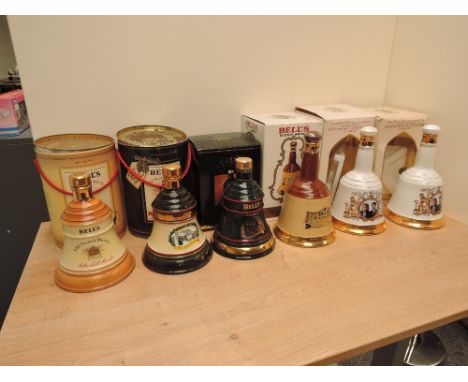 Six Wade Royal Decanters containing Bells Old Scotch Whisky, Christmas 1990, Christmas 1993, 1986 Prince Andrew &amp; Miss Sa