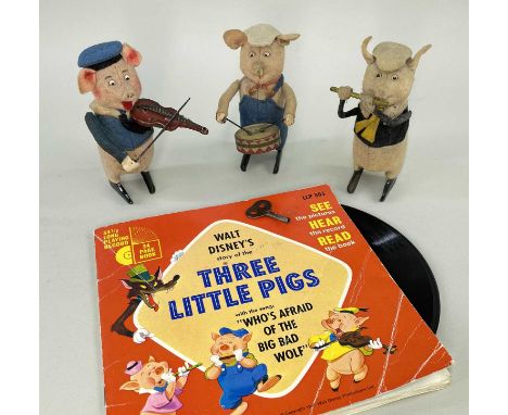 SCHUCO CLOCKWORK 'THREE LITTLE PIGS', c.1930s, felt covered pigs wearing original felt clothes and hats and playing tinplate 