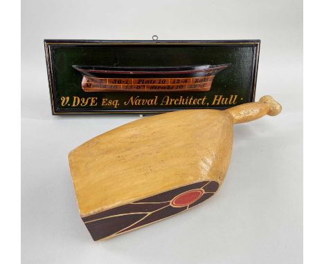 TWO WOODEN ADVERTISING PROPS being a butcher's ham-joint and a painted plaque with relief of a ship's hull inscribed with ana
