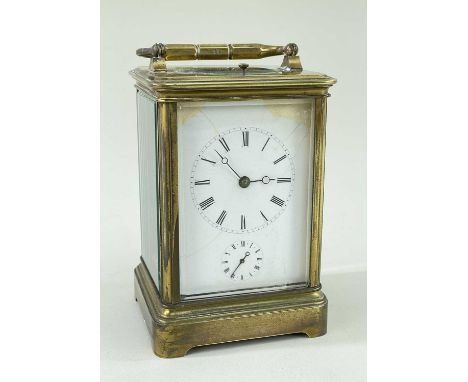GILT BRASS ALARM CARRIAGE CLOCK, white enamel roman dial, moon hands, alarm sub dial, platform escapement with strike on a co