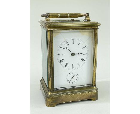 GILT BRASS ALARM CARRIAGE CLOCK, white enamel roman dial, moon hands, alarm sub dial, platform escapement with strike on a co