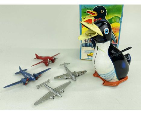 TINPLATE & DIECAST TOYS, comprising boxed Japanese clockwork tinplate 'Walking Panguin', with key, 12cm h, and Dinky red Ligh