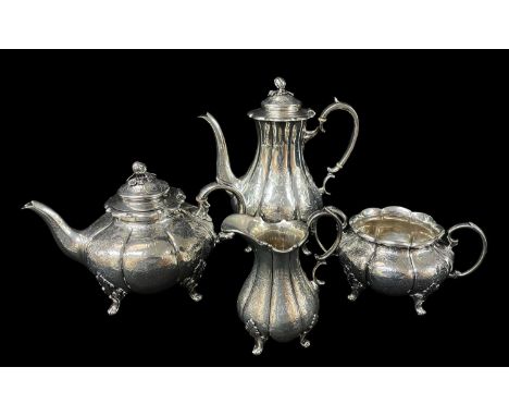 VICTORIAN SILVER TEA & COFFEE SERVICE, William Hunter, London 1869, melon form with melon knops, foliate engraved decoration 