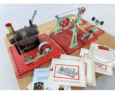 A MAMOD STATIC STEAM ENGINE & VARIOUS PULLEY SYSTEMS, together with a quantity of spare flexible steel spring driving beltsCo