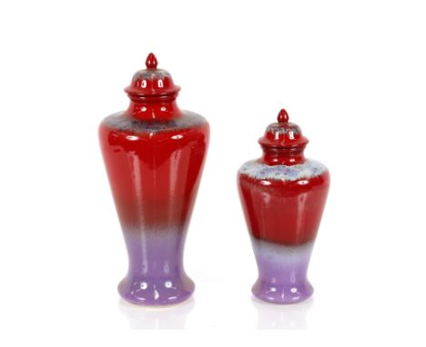 Two Poole pottery "Ruskin" series vases with domed covers, 31cm high, 24cm high